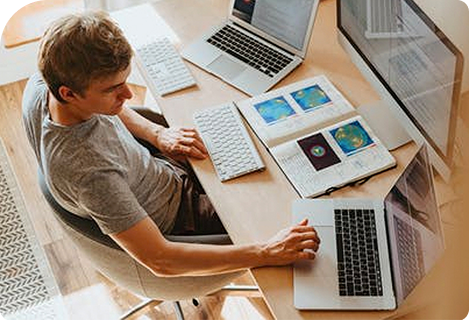 A person working at a desk with an Apple watch