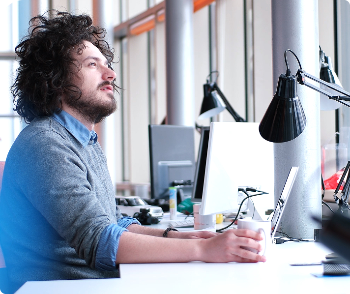 Two men looking at a computer screen